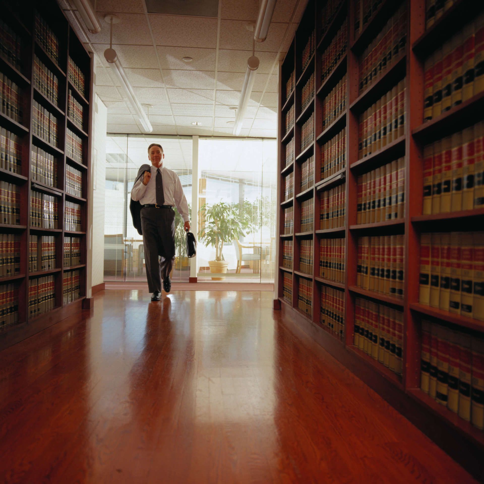 Lawyer Entering a Law Library — Lawyer in Clarksburg, WV Lawyer Entering a Law Library — Lawyer in Clarksburg, WV