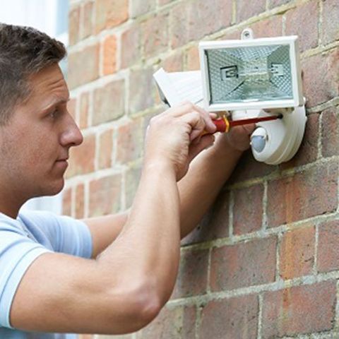 Commercial Electrical Services — Man Fixing Outside Lightings in Horsham, PA