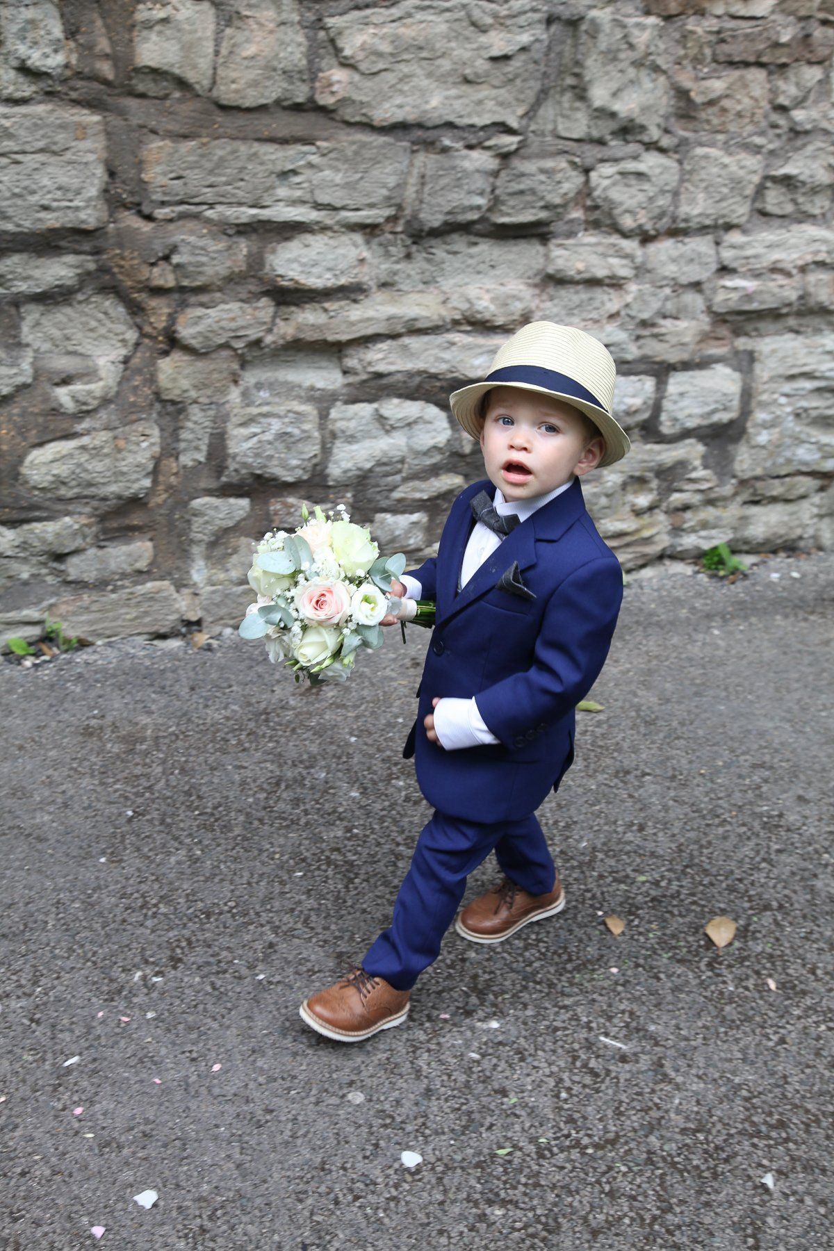 pageboy holding flowers