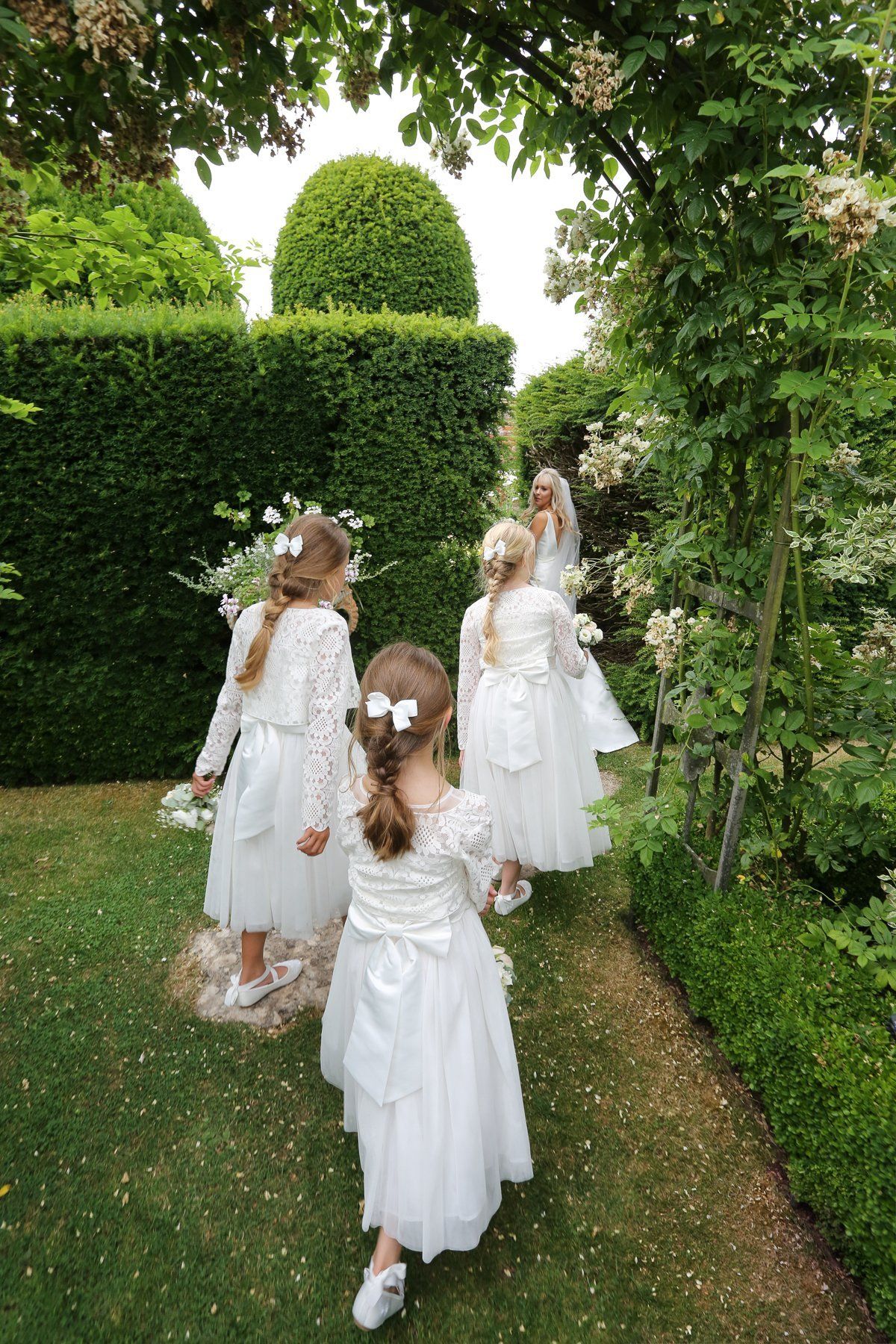 bridesmaids in white garden