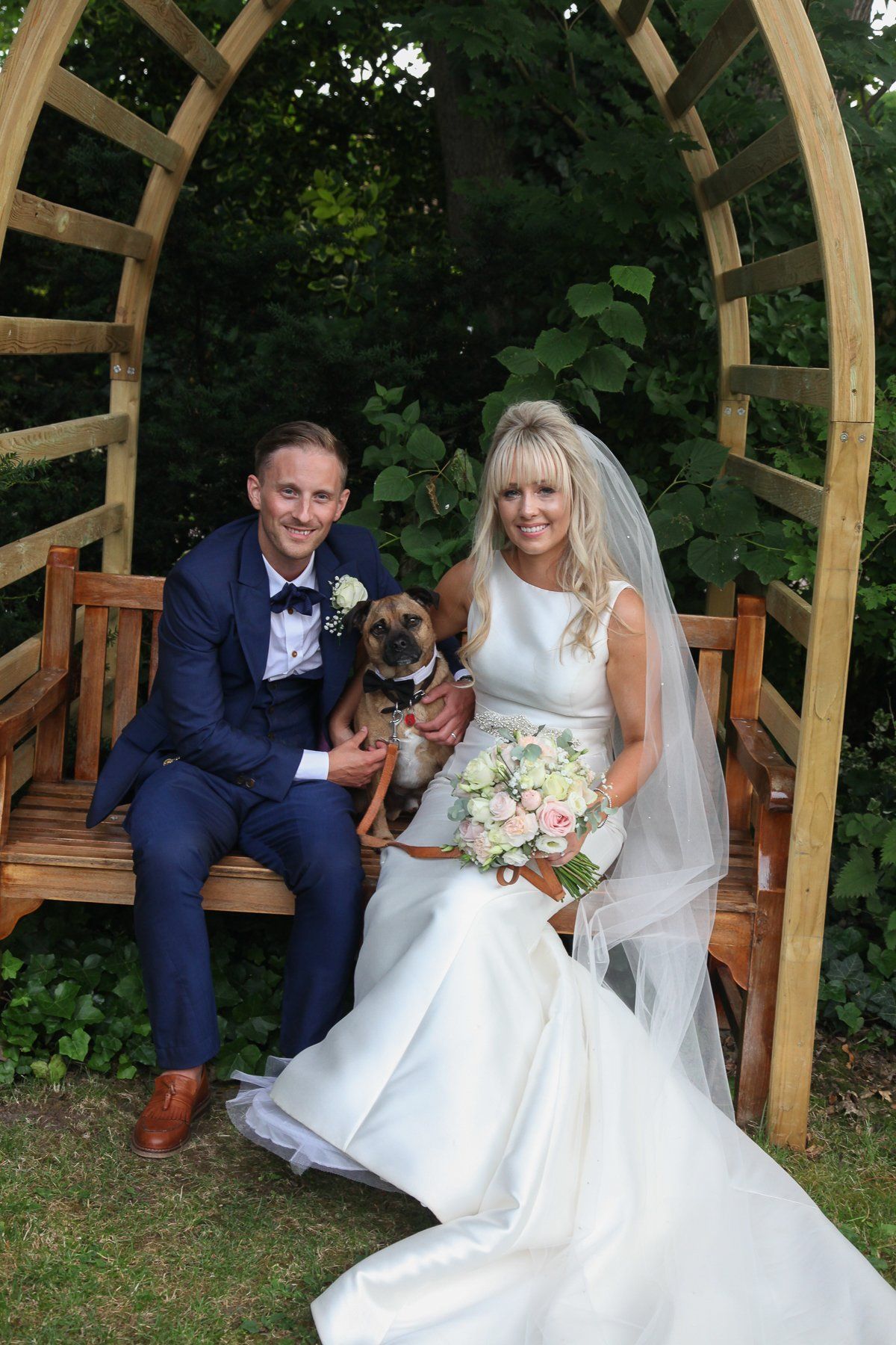 bride and groom with dog