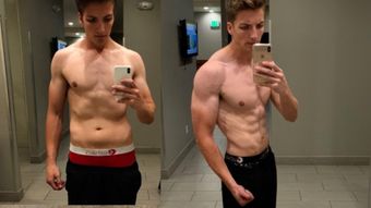 Two men are taking a selfie in front of a mirror.