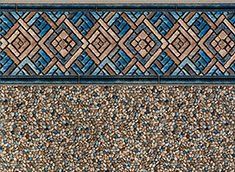 Pool liner with a patterned top border and speckled bottom.