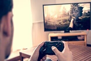 Man Playing Console Games — Computer Builds in Fairfield, ME Man Playing Console Games — Computer Builds in Fairfield, ME