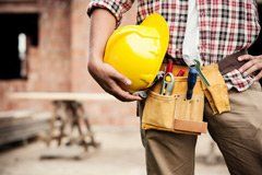 Worker Holding Construction Helmet - Superior Siding & Gutters in Norfolk, VA Worker Holding Construction Helmet - Superior Siding & Gutters in Norfolk, VA