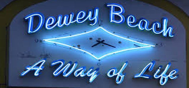 Neon sign of Dewey Beach with a clock and