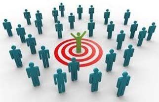 Green figure with arms raised in the center of a red bullseye surrounded by blue figures.