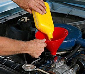 Golf Cart Service — Man The Filling Car Engine With Gassoline in Reno, NV Golf Cart Service — Man The Filling Car Engine With Gassoline in Reno, NV