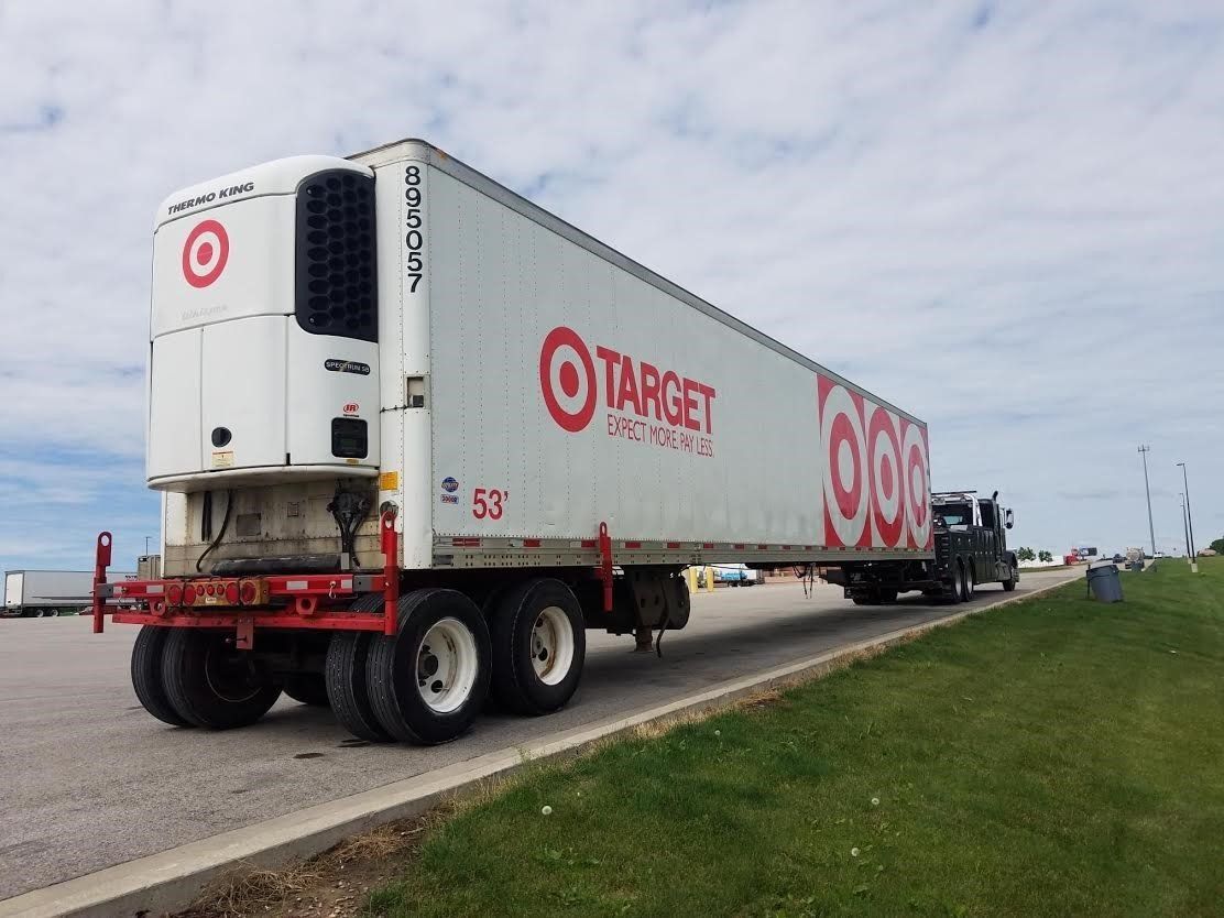 A target semi truck is driving down the road.