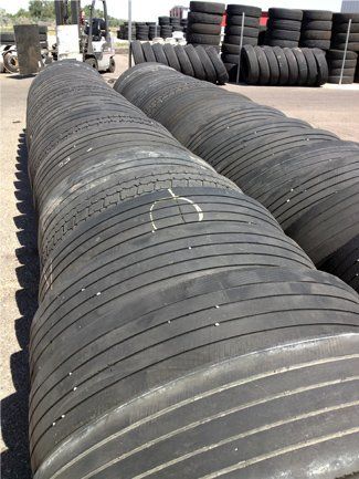 A bunch of tires are stacked on top of each other