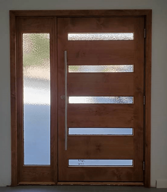 A wooden door with a few windows on it