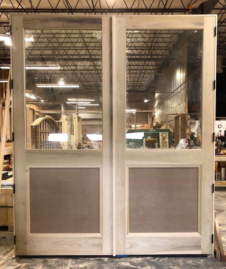 9 feet tall , 2-1/4 thick, one pair of several doors with laminated glass and sound deadening features for a private recording studio on Long Island.