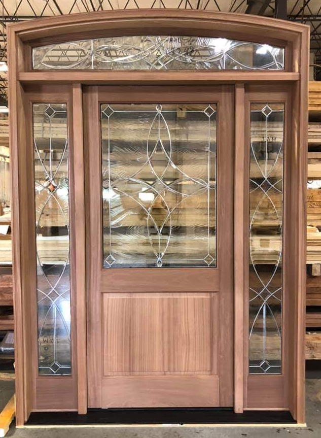 Half lite door with decorative glass and arched transom