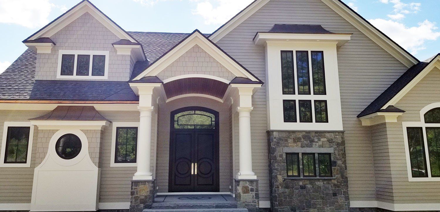 A large house with a lot of windows and columns