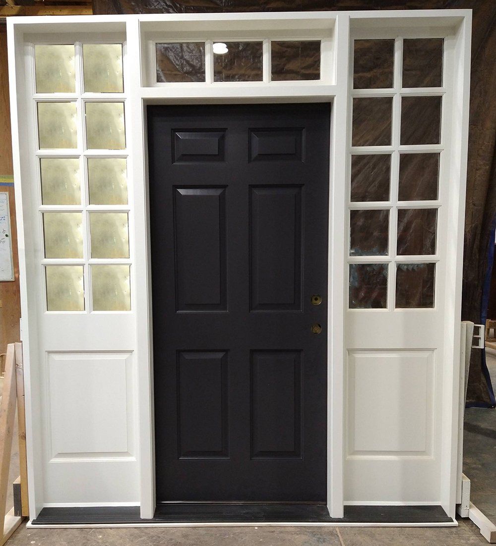 Mahogany entry door with wide sidelites and transom
