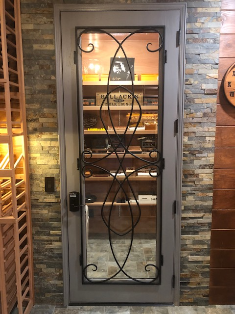 A door with a wrought iron design on it