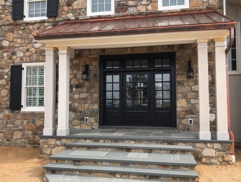 Satin black grand entry way constructed of mahogany wood features 20
