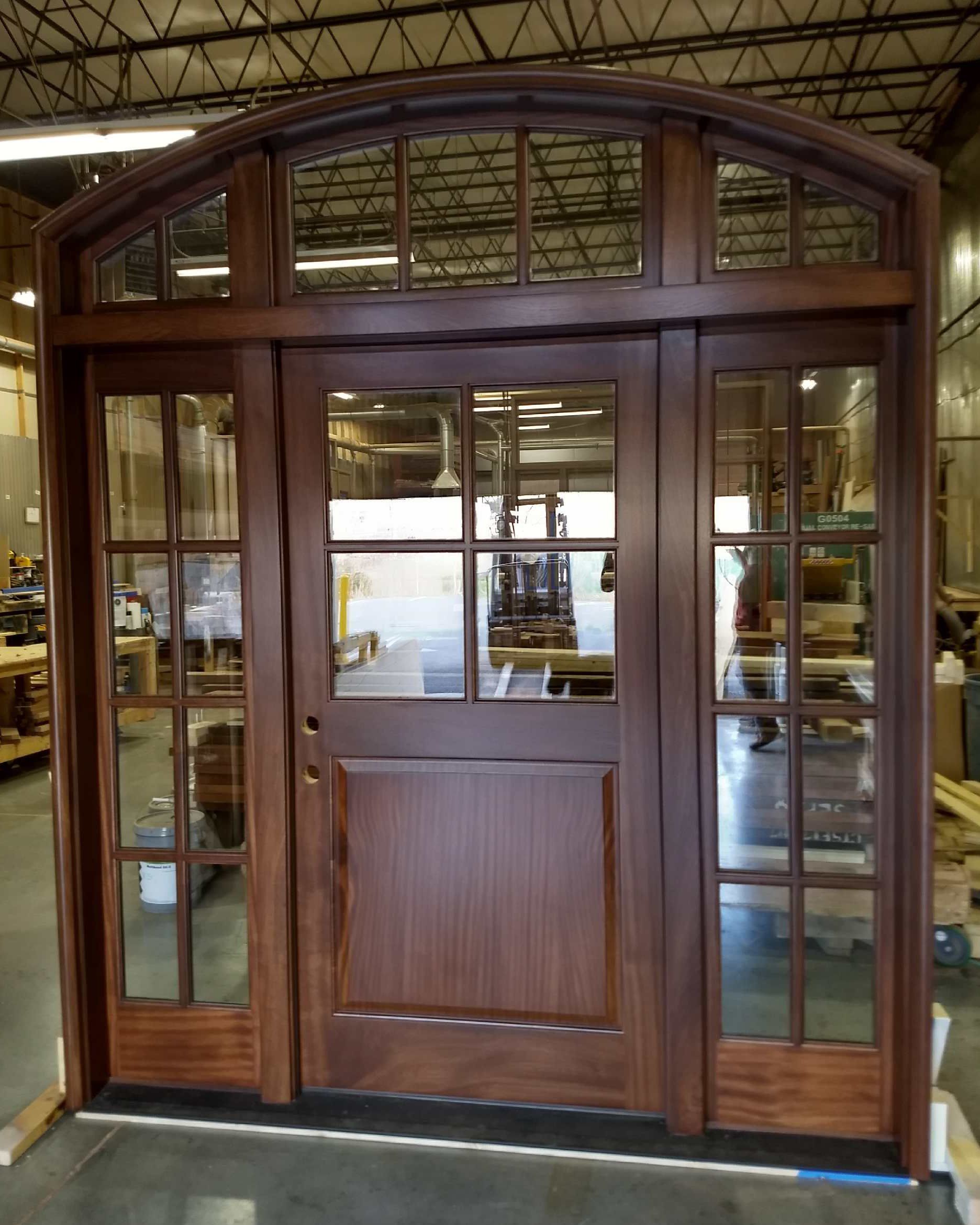 Half lite door with TDL upper panel, two sidelights and arched transom