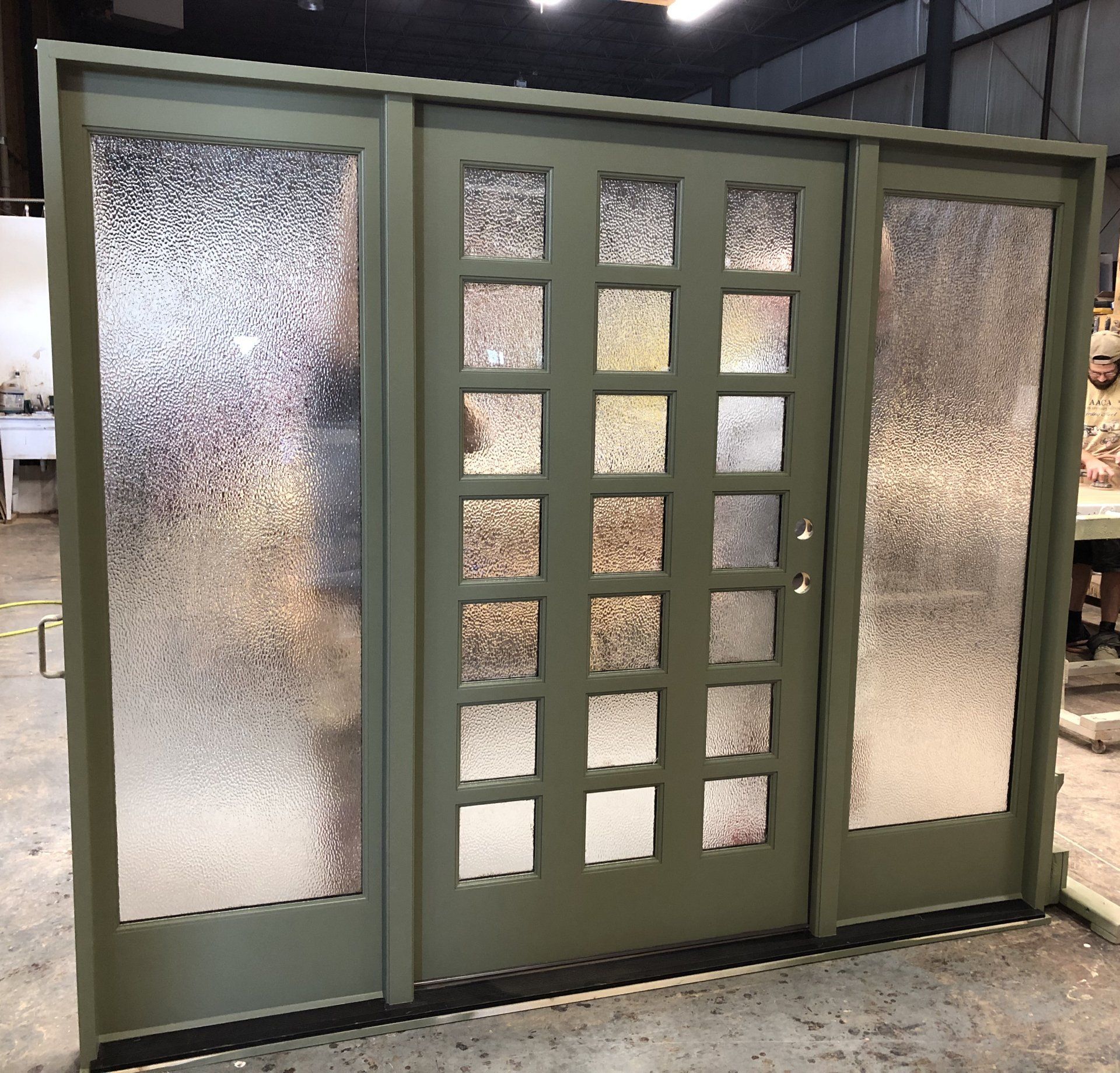 18 lite entry door flanked by two hammered glass full light side windows