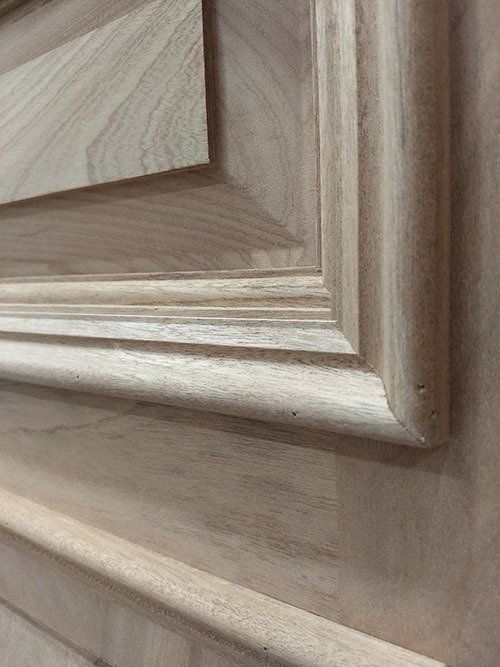 A close up of a piece of wood on a wall.