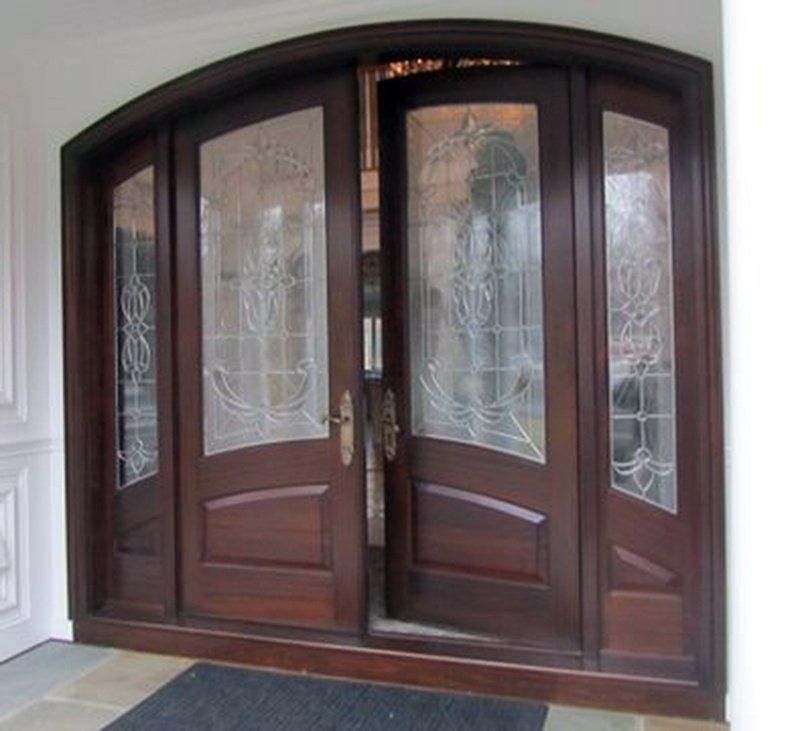 Arch top double doors and side lites with decorative glass