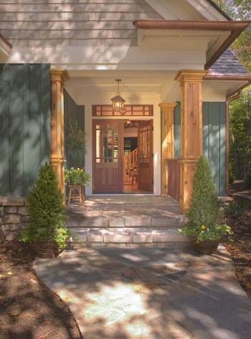 The front door of a house with a stone walkway leading to it