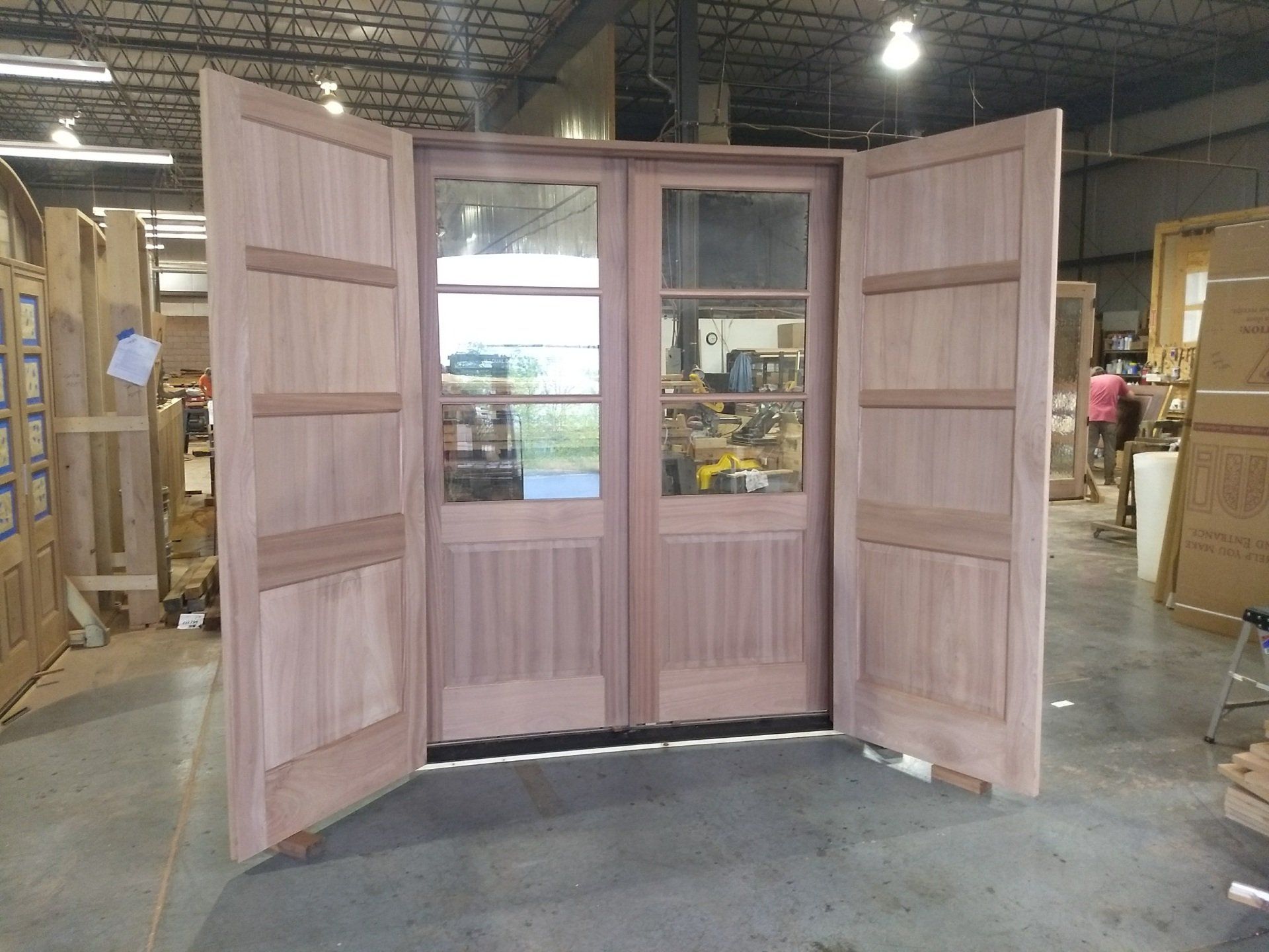 Custom mahogany double door unit with storm doors