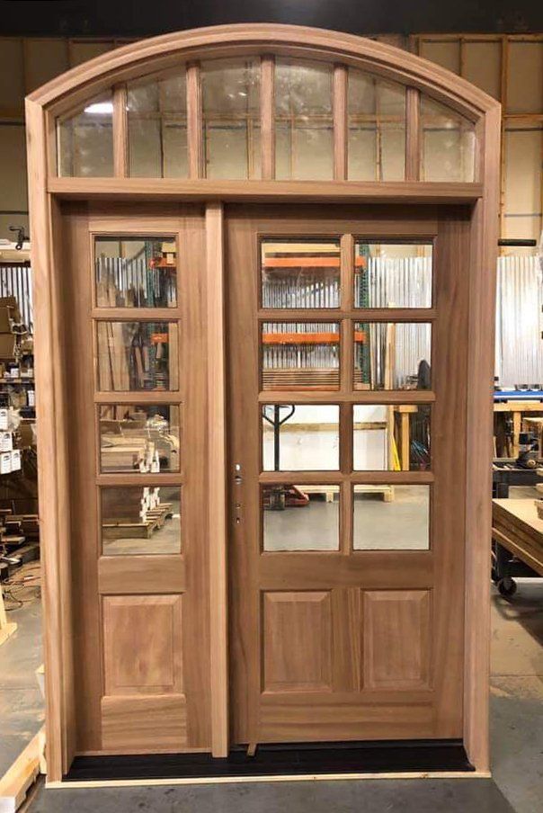 Mahogany craftsman entry door with sidelites and dentil shelf