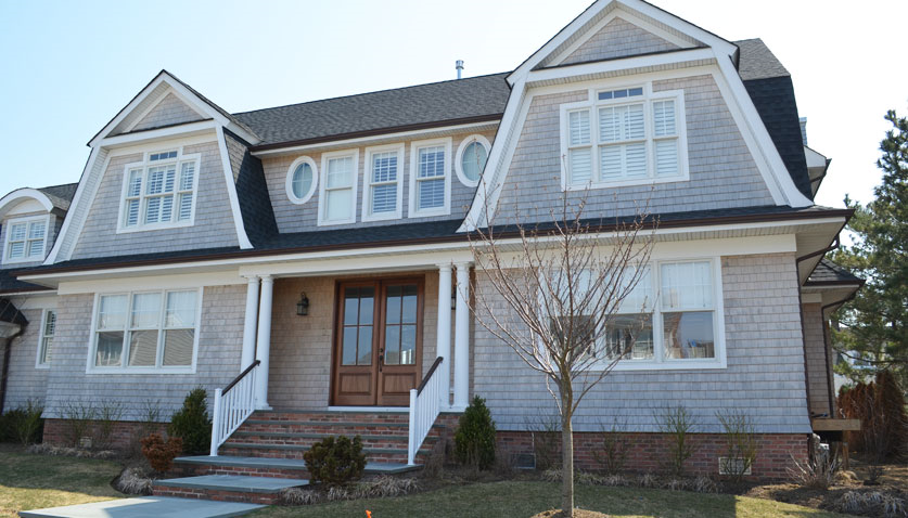 A large house with a lot of windows and stairs