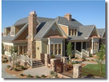 A large house with a chimney on the roof