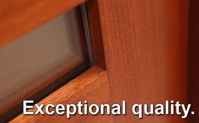 A close up of a wooden door with the words exceptional quality written on it.