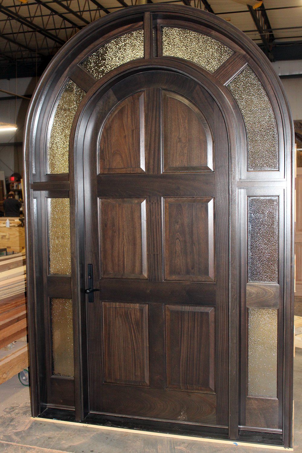 Round top solid mahogany wood door with hammered glass surround