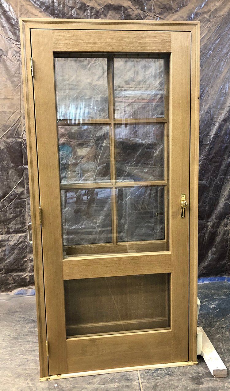 Traditional 6 lite Rift Sawn White Oak wood door with storm door