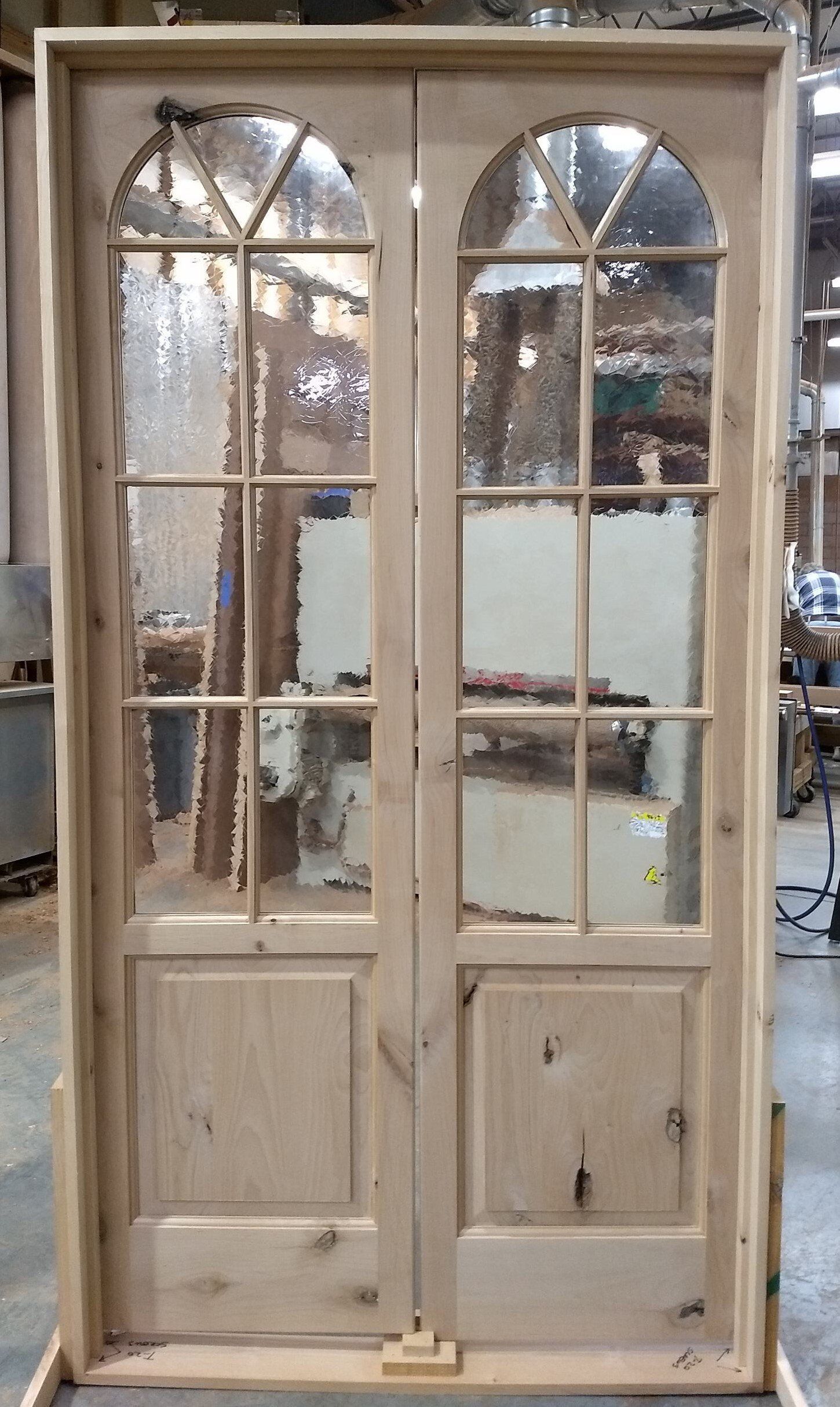 Knotty alder pantry doors with antique glass