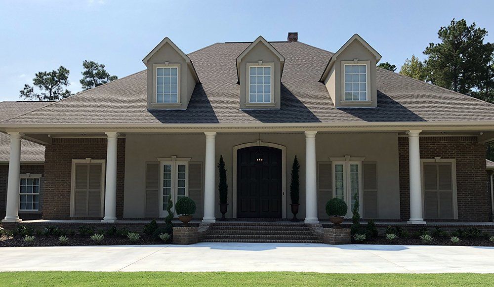 A large house with a large porch and columns