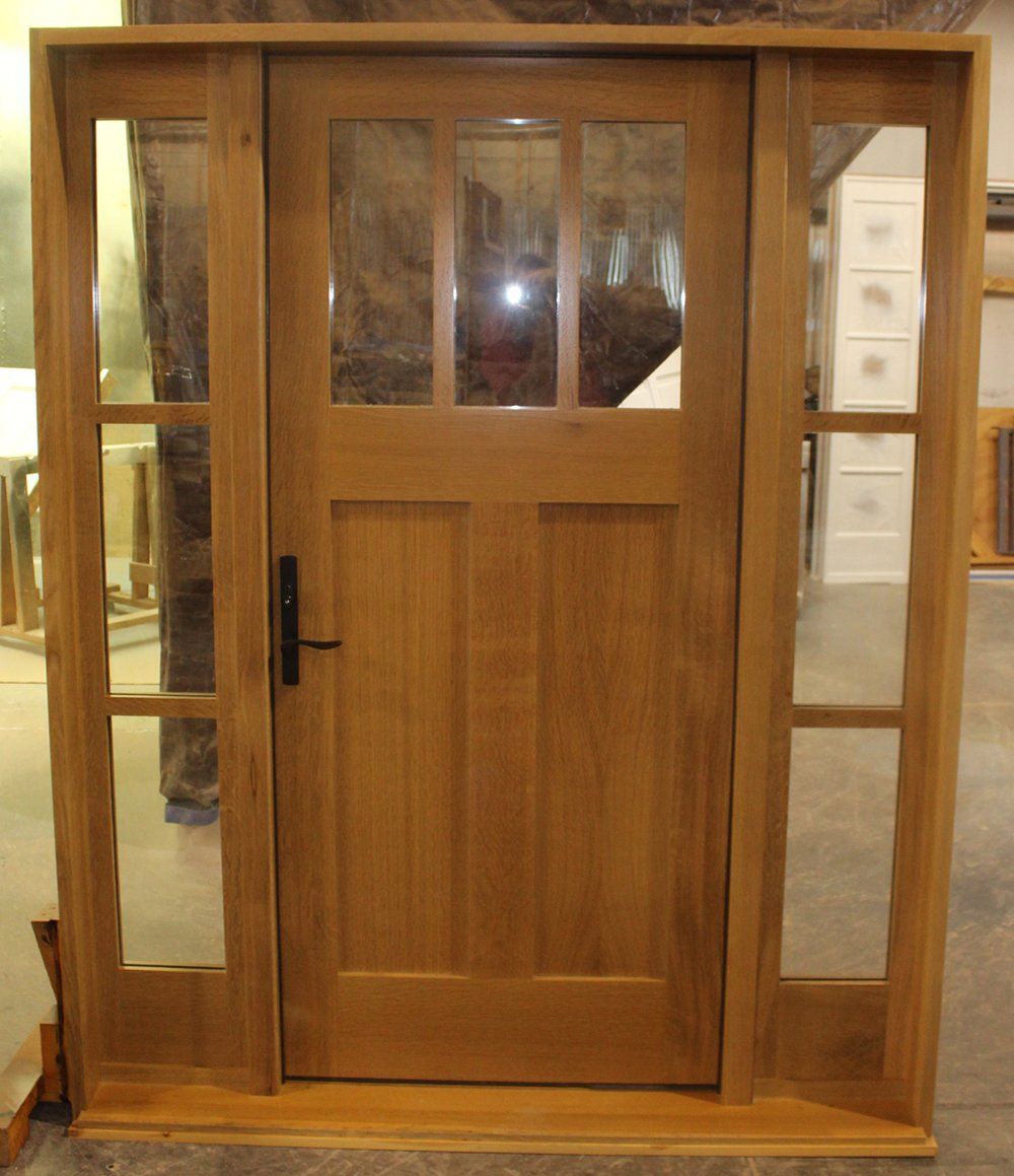 A wooden door with a lot of windows on it