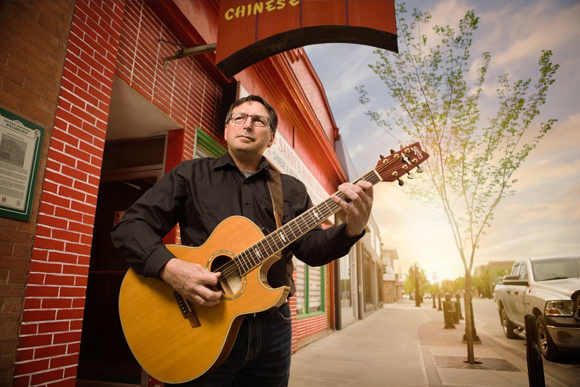 PROFESSIONAL PHOTOGRAPHY  FEATURING RURAL ALBERTA GUITAR PLATER FOR VISION CREDIT UNION BY IVY DESIGN INC