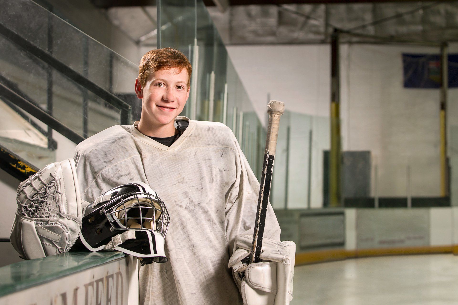 PROFESSIONAL PHOTOGRAPHY  FEATURING RURAL ALBERTA HOCKEY PLAYER FOR VISION CREDIT UNION BY IVY DESIGN INC