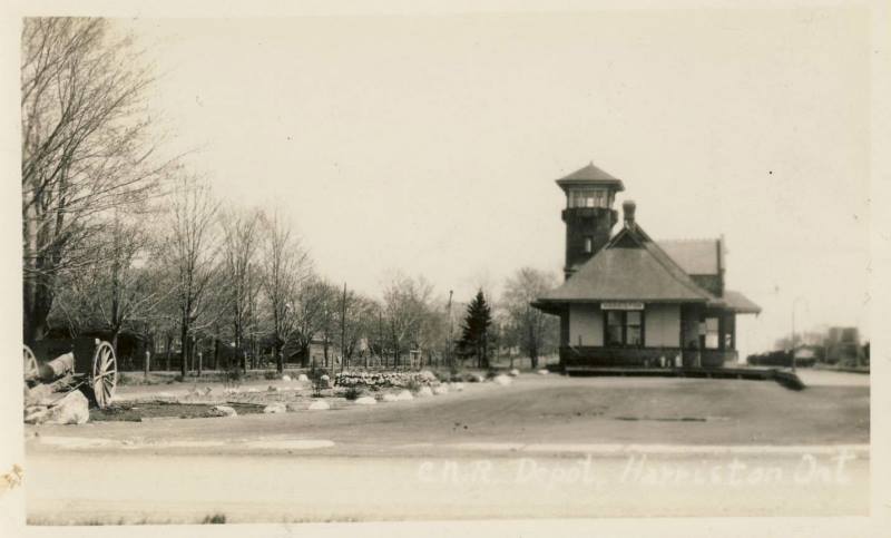 A black and white photo of a train station