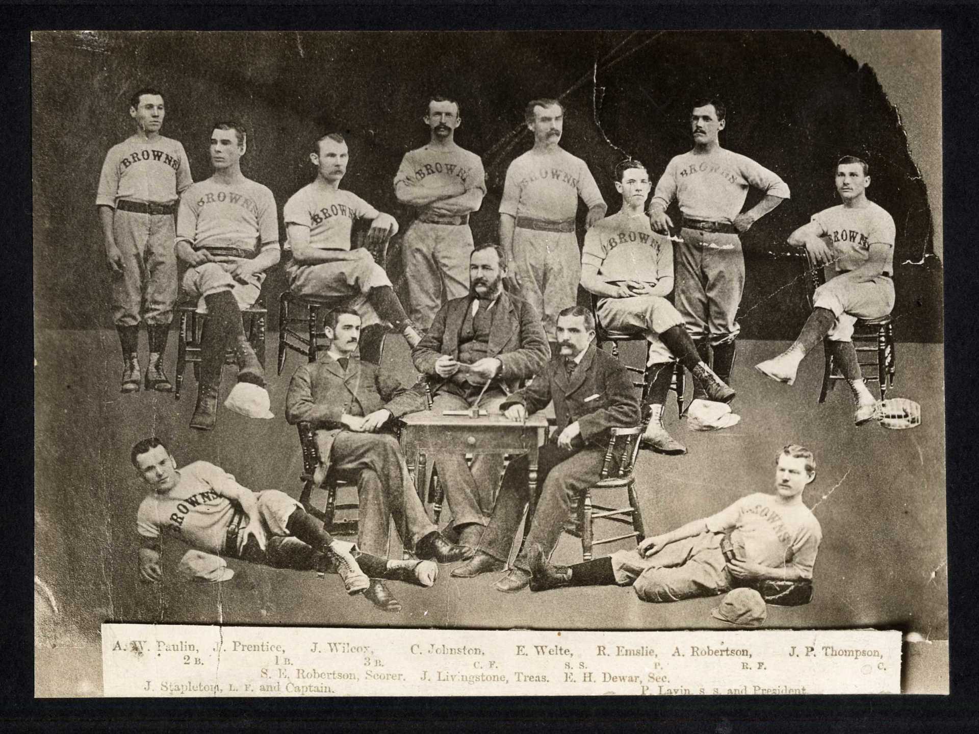 A group of men are posing for a picture and one of them is wearing a jersey that says rays