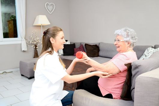 health aide working with elderly women