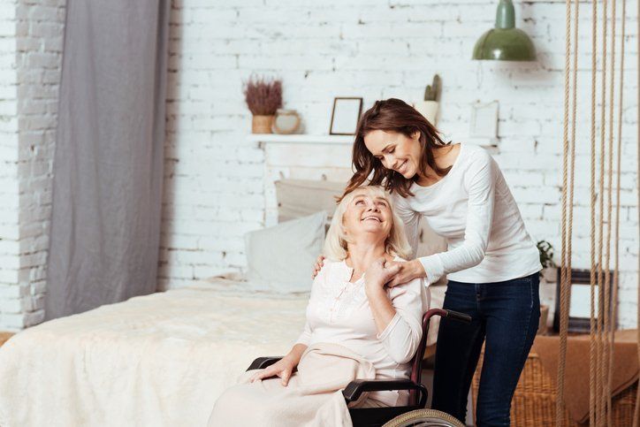 Caregiver and Patient Smiling at One Another