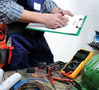 Pumps — Man Checking the Electrical Status in Visalia, CA Pumps — Man Checking the Electrical Status in Visalia, CA