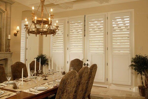 Plantation shutters in dining room — Window Shades in Louisville, KY Plantation shutters in dining room — Window Shades in Louisville, KY