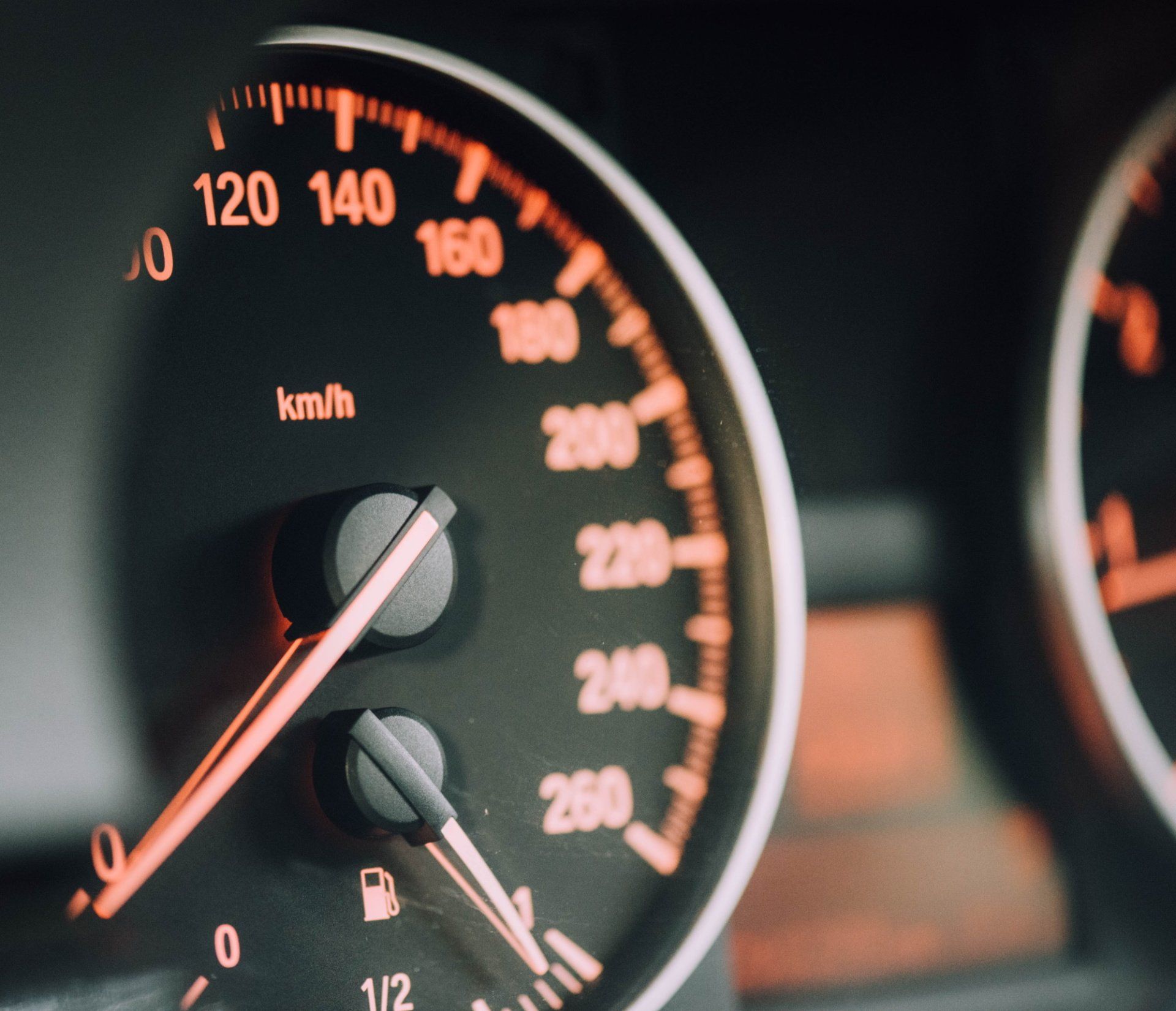 A close up of a speedometer showing 120 140 160 and 200 km / h