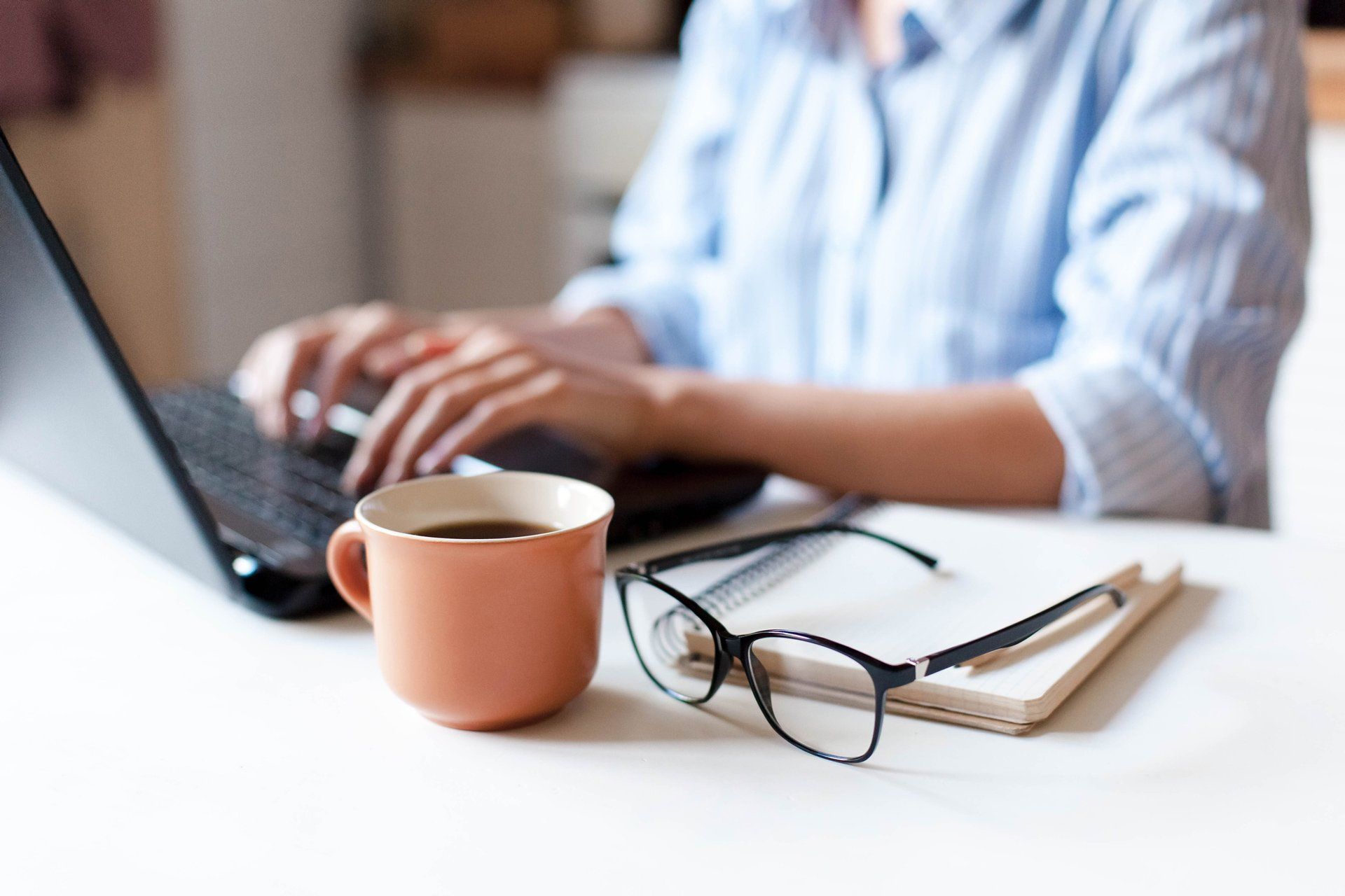 Woman Using A Laptop — Atlanta, GA — ATLA Housing Partnerships