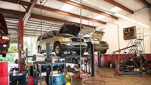Winter Park Auto Repair — Two Car Under Repair in Apopka, FL