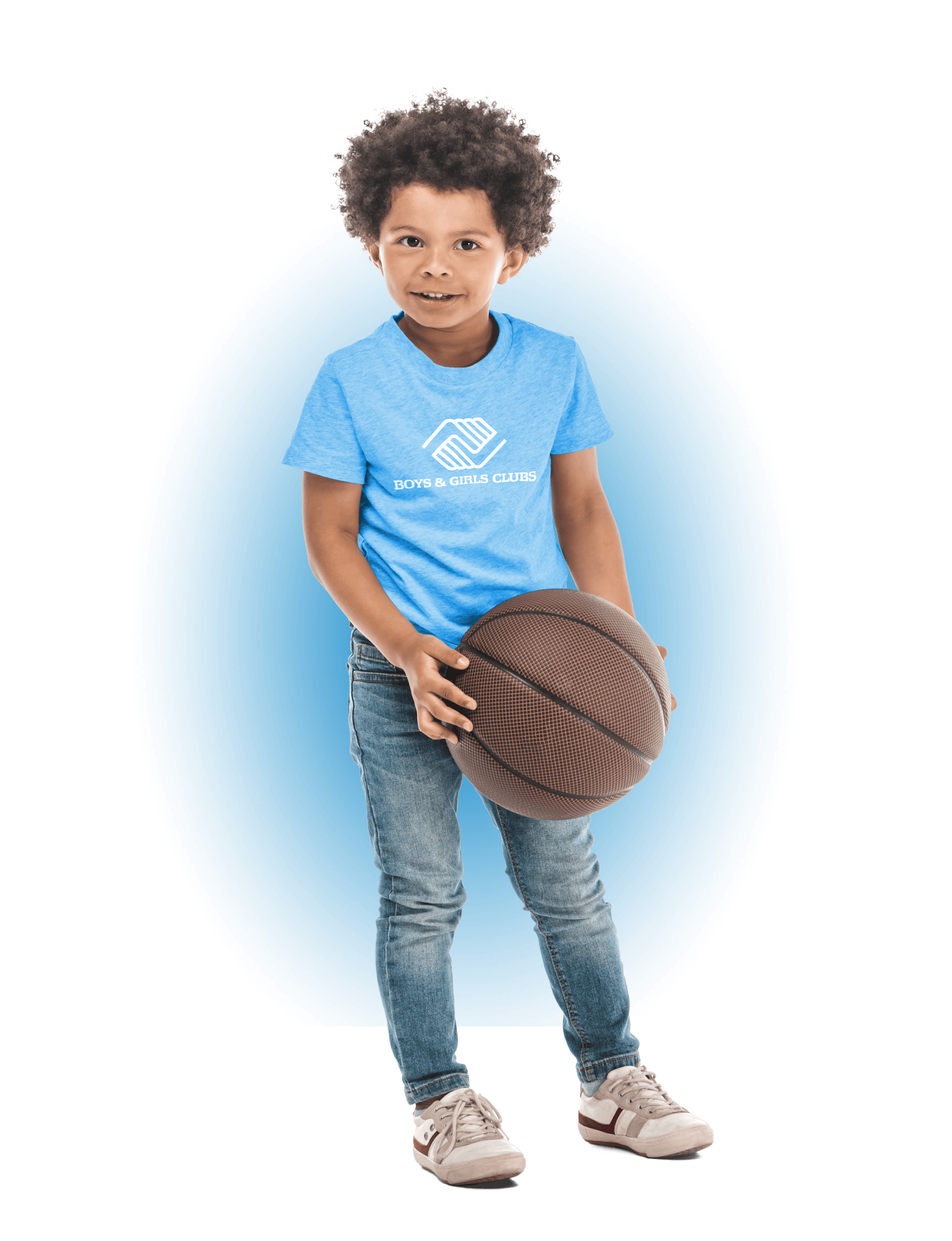 A boy wearing a blue Boys & Girls Club shirt holding a basketball