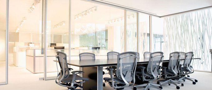 Office desk inside glass wall room, available from Marrick Commercial Interiors in Guildford