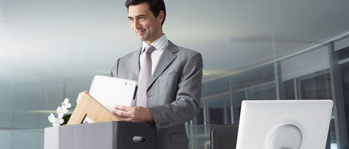 Hassle free office relocation services with Marrick Commercial Interiors. Call 01483 306 500 Businessman with files in an office